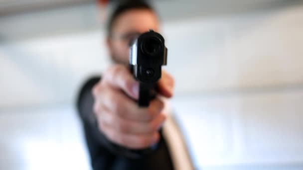 Secret Agent Raises Firearm Pistol Camera Hangar Bay — Stock Video