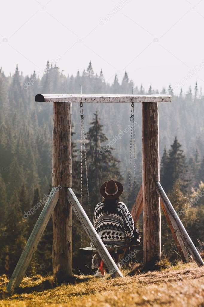 Person sitting on a swing 