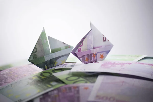 Bankovky origami loď — Stock fotografie