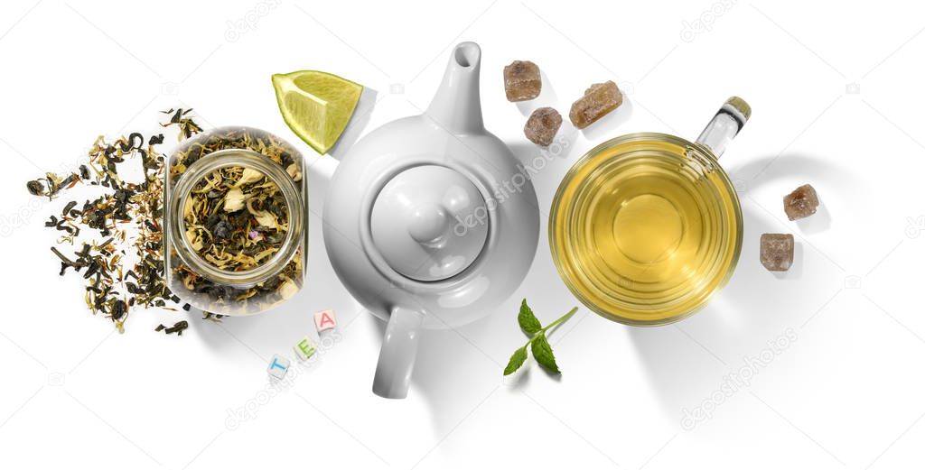 Green tea with aromatic additives and accessories. Top view on white background