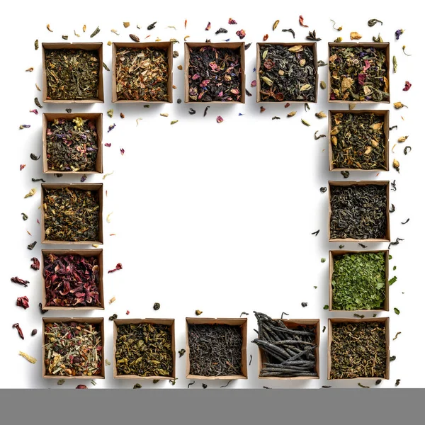 Gran variedad de tés en forma de marco sobre fondo blanco. La vista desde arriba —  Fotos de Stock