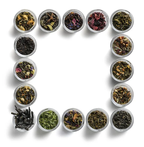Gran variedad de tés en forma de marco sobre fondo blanco. La vista desde arriba —  Fotos de Stock