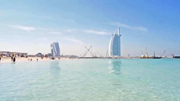 Burj al Arab hotel in the form of a sail in the city of Dubai in the UAE. Clear Sunny day March 13, 2020 — Stock Video