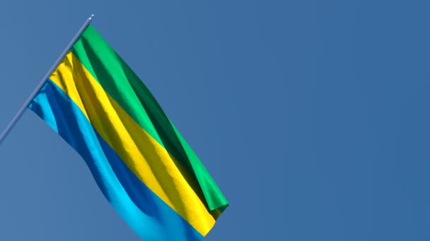 The national flag of Gabon flutters in the wind — Stock Video