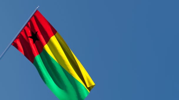 Bissau-Guinea nemzeti zászlaja a szélben. — Stock videók