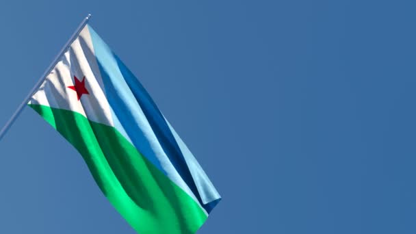 Dzsibuti nemzeti zászlaja a szélben van. — Stock videók