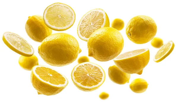 Yellow lemons levitate on a white background — Stock Photo, Image