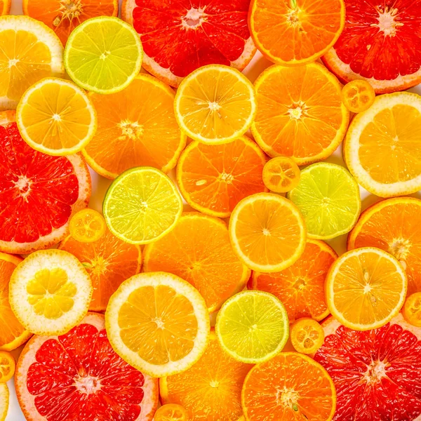 beautiful fresh sliced mixed citrus fruits like background, conc