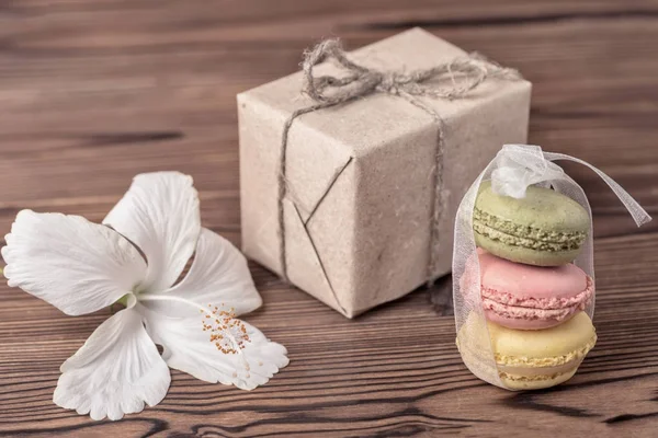 paper box, colorful macarons cake tied  ribbon, hibiscus flower and empty blank,  Valentines day concept