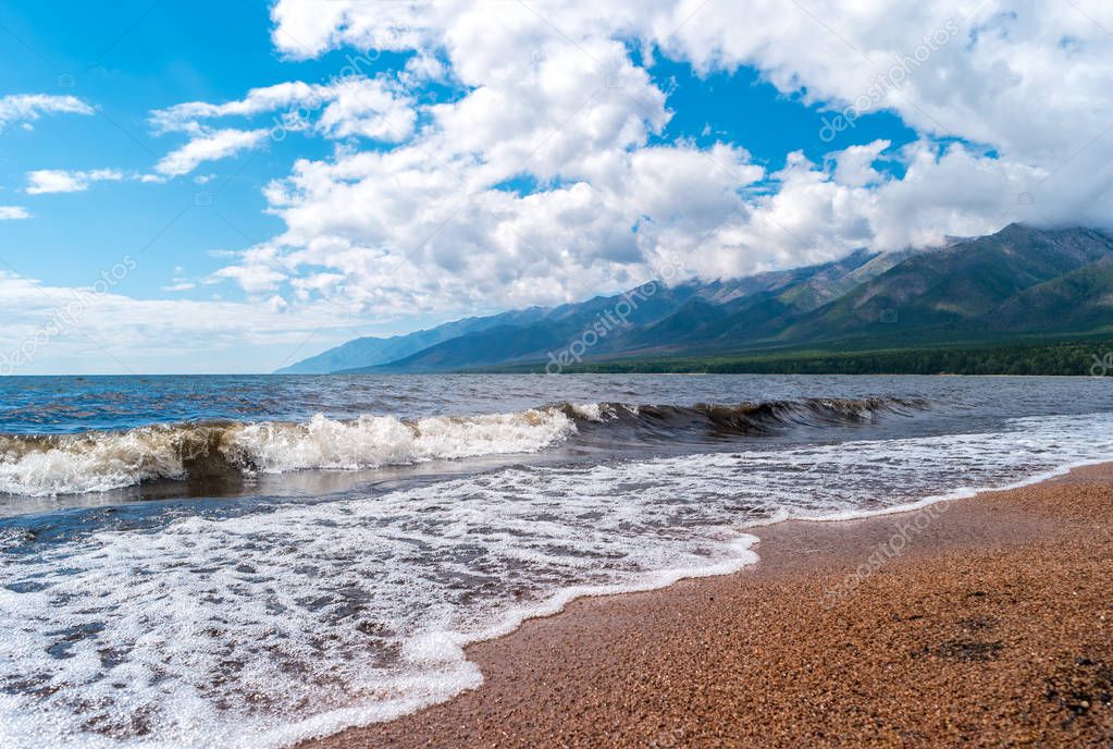 The shore of Baikal Lake with view of the peninsula of the Holy Nose.