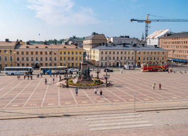 Helsinki, Finland - June 21, 2019: The Senate square at the center of the Finnish capital. Tourists came to showplace on sightseeing buses.