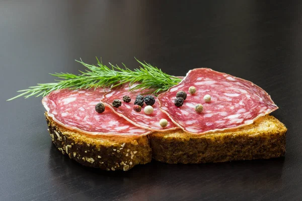 Fresh sandwich with ham and dill, on the table — Stock Photo, Image
