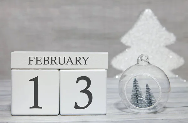 stock image Cube shape calendar for February 13 on wooden surface and light background with empty space for text.