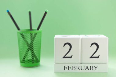 Desk calendar of two cubes for February 22 clipart