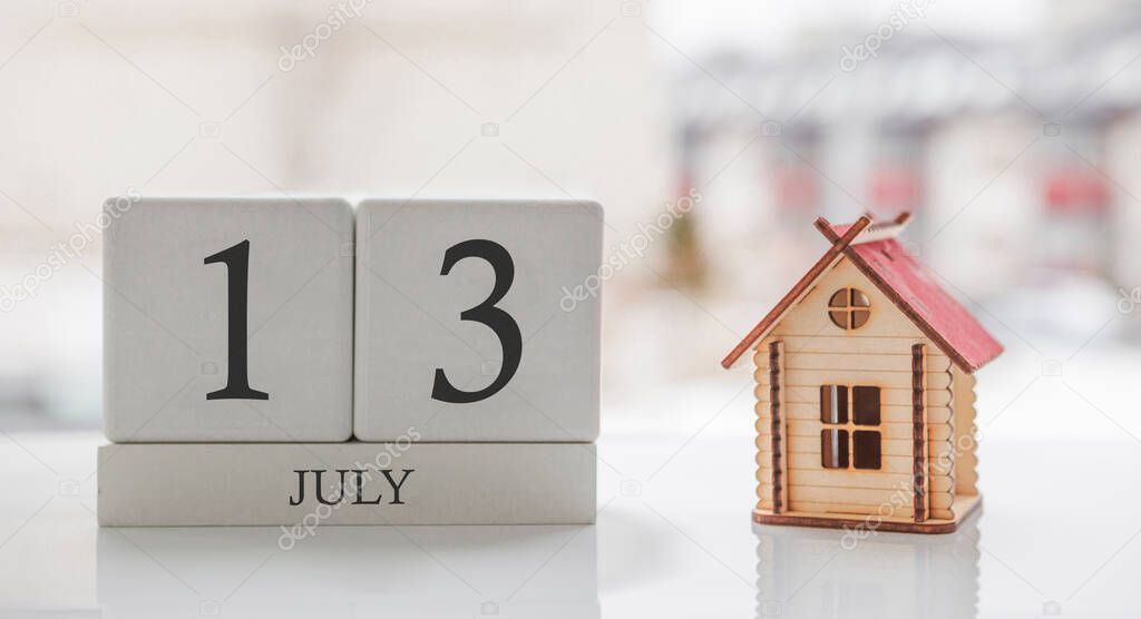 July calendar and toy home. Day 13 of month. Card message for print or remember