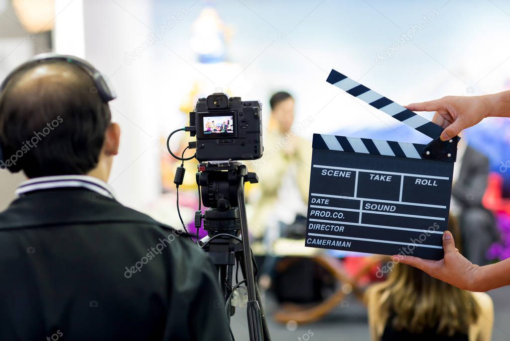 Man hands holding movie clapper.Film director concept.camera show viewfinder image catch motion in interview or broadcast wedding ceremony, catch feeling, stopped motion in best memorial day concept.