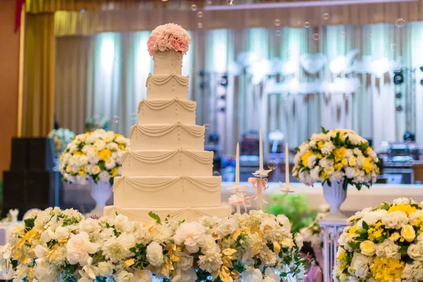 Decoration wedding with cake bubble and lighting in ceremony. Beautiful Wedding Cake. Abstract blurred soft of wedding cake and bubbles in the wedding banquet.