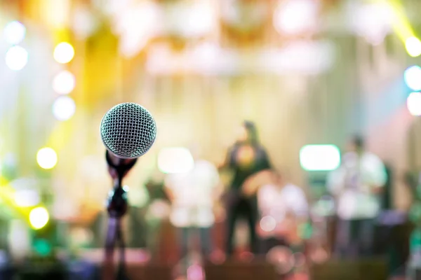 microphone in concert hall or conference room soft and blur style for background.Microphone over the Abstract blurred photo of conference hall or seminar room background.