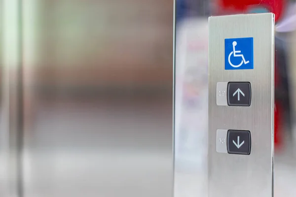 Image of disabled lift button. Stainless steel elevator panel push buttons for blind and disability people. Push Button For the disabled. Care and technology. Elevator buttons for disabled people.