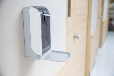The automatic alcohol dispenser . infection and hospitably concept. save  And protect disease virus against germs  and clean in the public area. 