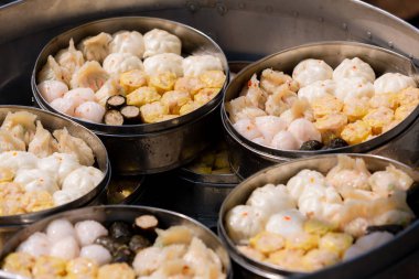 Dim sum in bamboo steamer, chinese cuisine. Dim sum in steam chinese cuisine hong kong. yumcha,The Arrangment of various dim sum in bamboo steamer with chinese bun