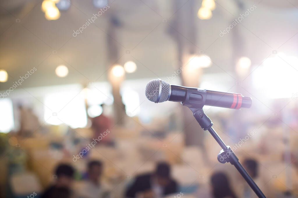 microphone on blurred background of conference room
