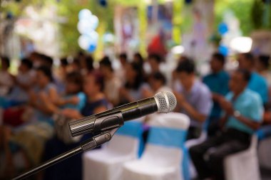 microphone on the background of the crowd of people