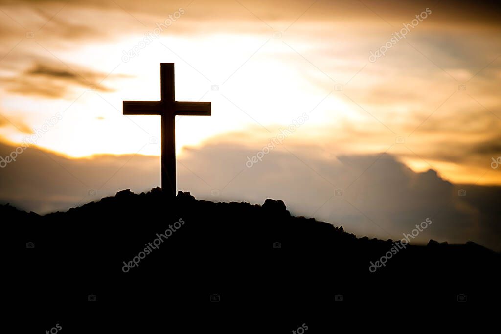 cross on the background of the sunset