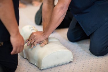 male physiotherapist working with a massage mat
