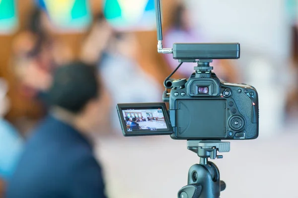 professional photographer recording video camera on the street