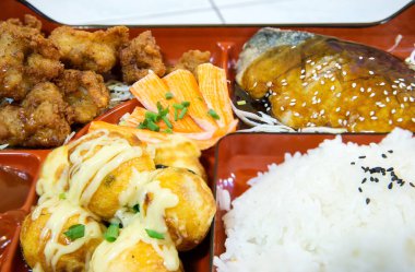 chicken and vegetables in a plate on a white background
