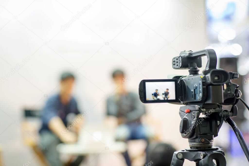 professional photographer recording video conference with blurred background