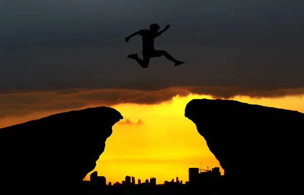 Silhouette Man Jumping Cliff — Stock Photo, Image