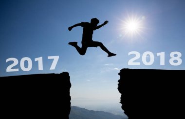 silhouette of a man running on the sky background