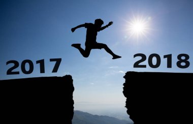 silhouette of a man running on the sky background