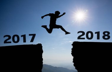 silhouette of a man running on the sky background