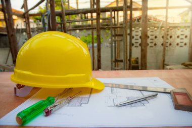 construction concept. helmet and hat on the table.