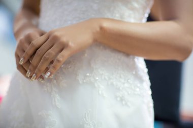 bride with wedding rings on her hands