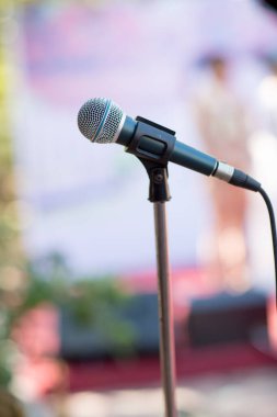 microphone on blurred background of modern music hall