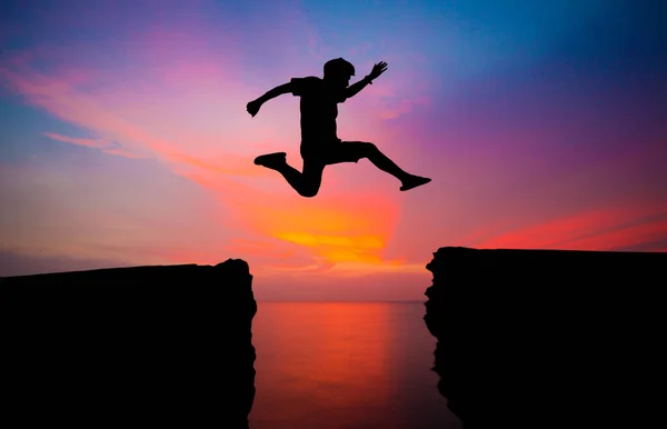 Silhouette Man Jumping Sunset Sky Background — 图库照片