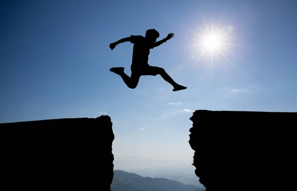 Silhouette Man Jumping Cliff — Stock Photo, Image