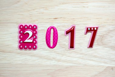 Geri sayım mutlu yıllar 2017. Eski moda ahşap dokular üzerine 2017 numaradan iç çekiş sembolü. Yazı için boş kopya alanı veya diğer nesneler için mutlu yeni yıl penis yılı.