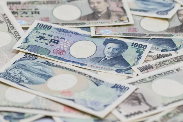 Japan yen notes. Ten thousand yen in cycle form, financial and economy of SEA. image for background, wallpaper.10000 Japanese Yen Note, stack layers of japan banknotes ten thousand yen.