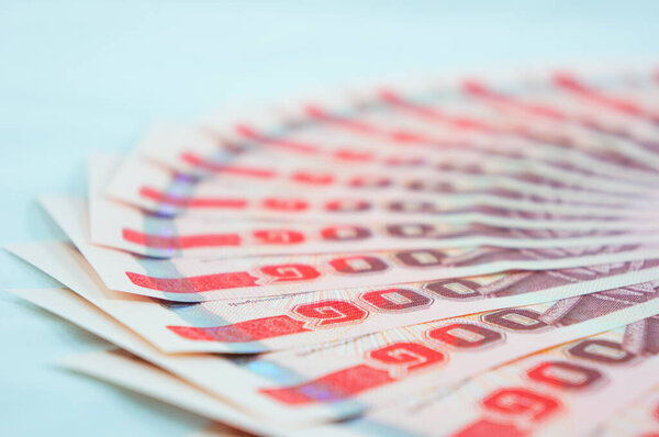 close up of a red and white money banknotes