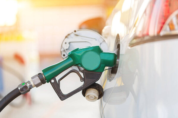 Refill and filling Oil Gas Fuel at station.Gas station - refueling.To fill the machine with fuel. Car fill with gasoline at a gas station. Gas station pump. 