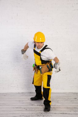 A professional building fitter ready for action at any time.