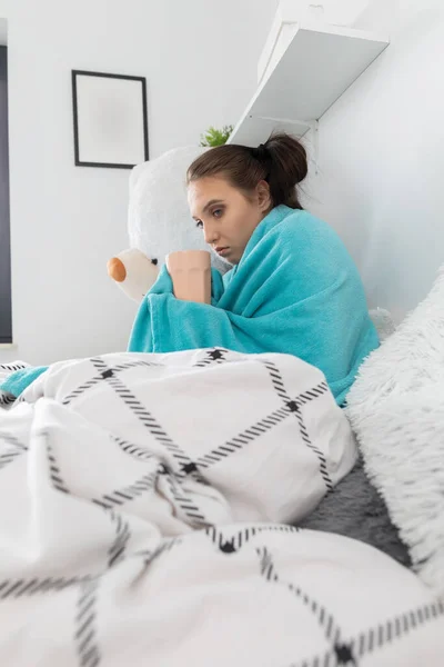 The young girl drinks a special hot infusion of herbs to return to full health faster.