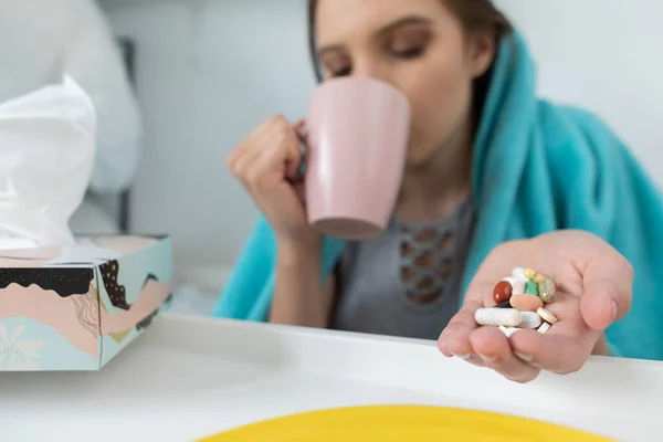 Pills and vitamins to be swallowed during chronic illness and high body temperature.