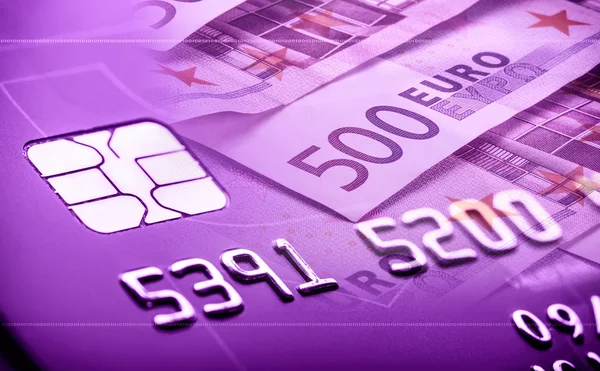 Credit or debit payment card. Macro shot credit card with euro banknotes