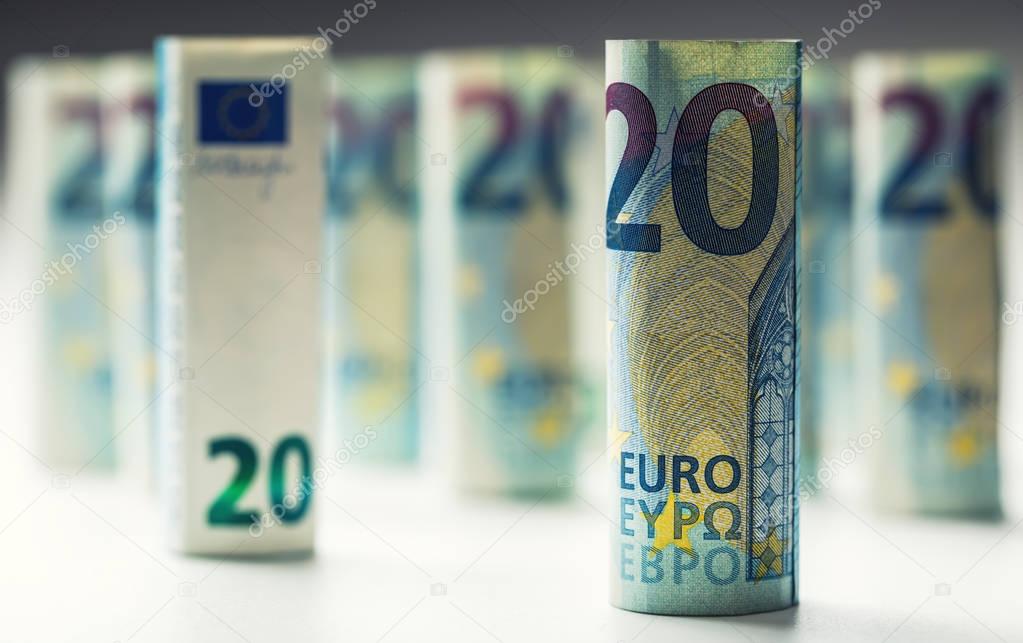 Several hundred euro banknotes stacked by value.Rolls Euro banknotes.Euro currency money. Banknotes stacked on each other in different positions